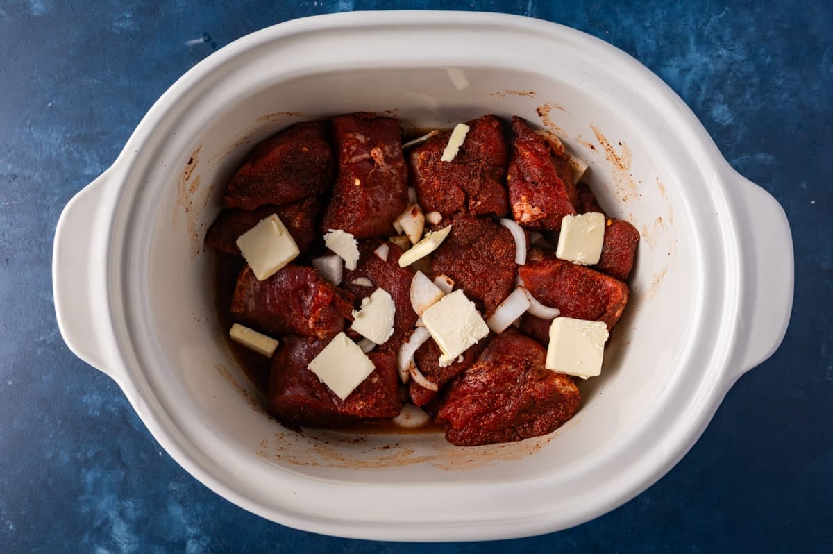 ingredients for pulled pork tenderloin in a slow cooker