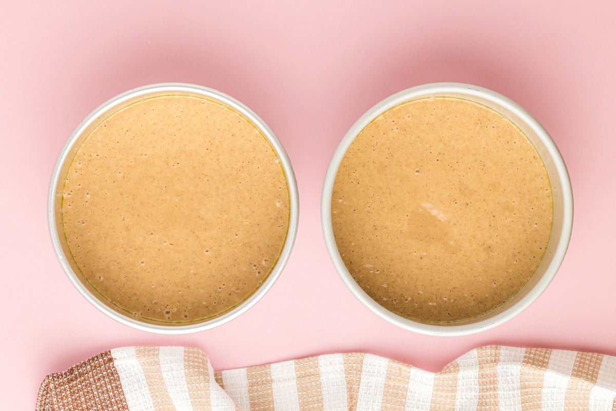 unbaked applesauce cakes in pans