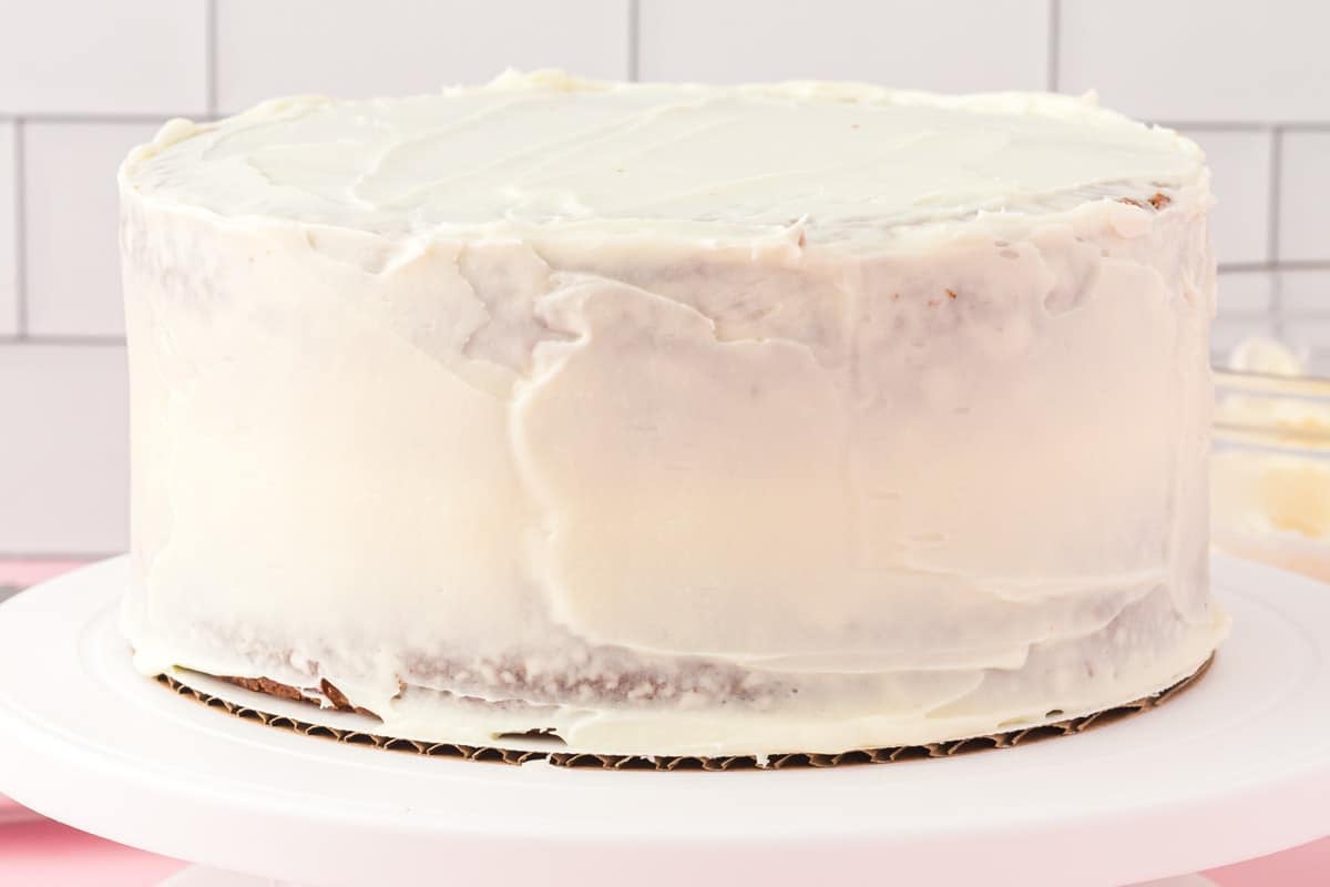 frosted applesauce spice cake on a table
