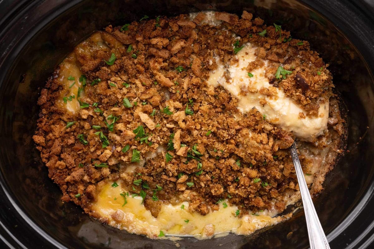 crockpot chicken and stuffing with a spoon