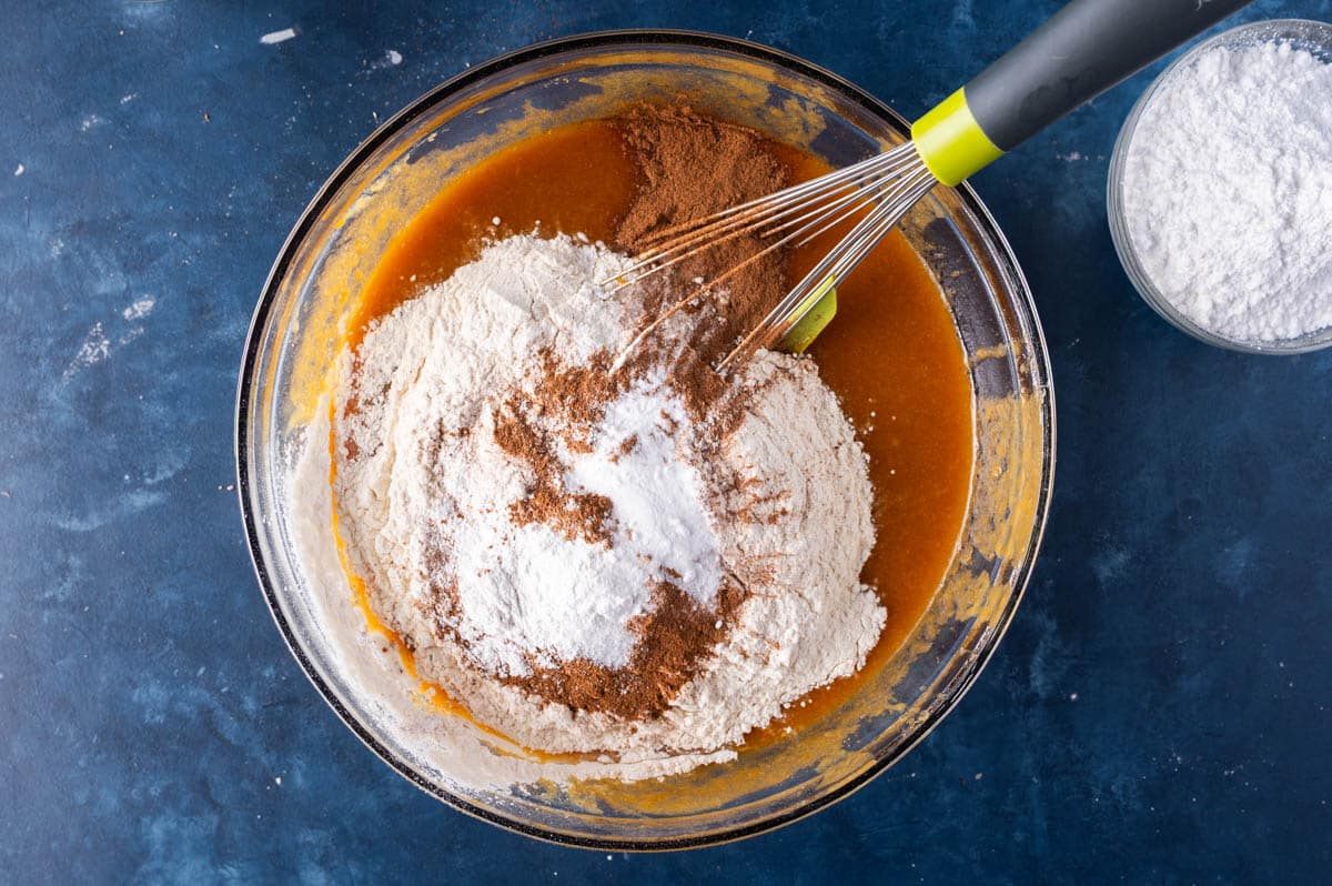 dry ingredients over wet ingredients in a mixing bowl