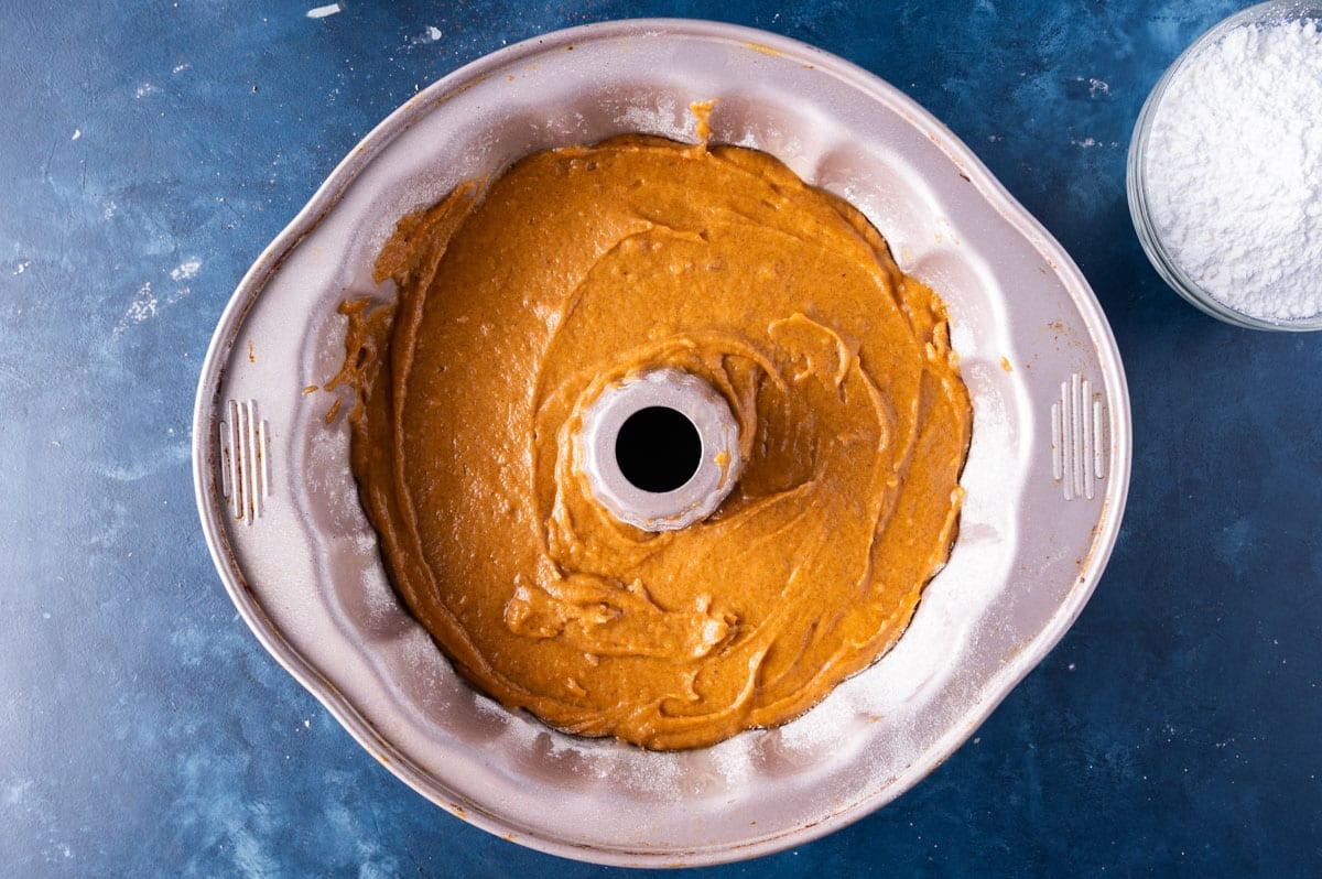 an unbaked bundt cake in a pan on a table