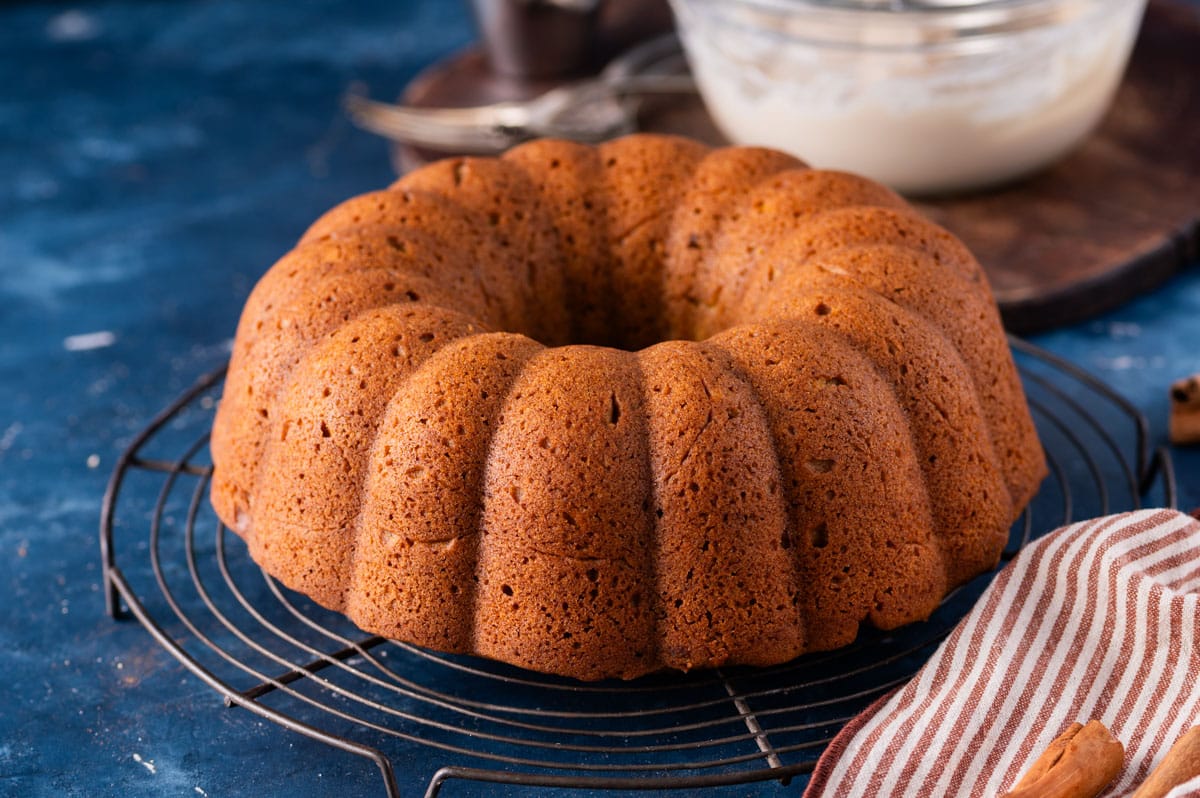 a plain bundt cake on a cooling rack