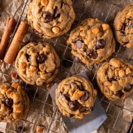 pumpkin spice chocolate chip cookies on a wire rack