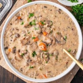 wild rice mushroom soup on a table with a spoon