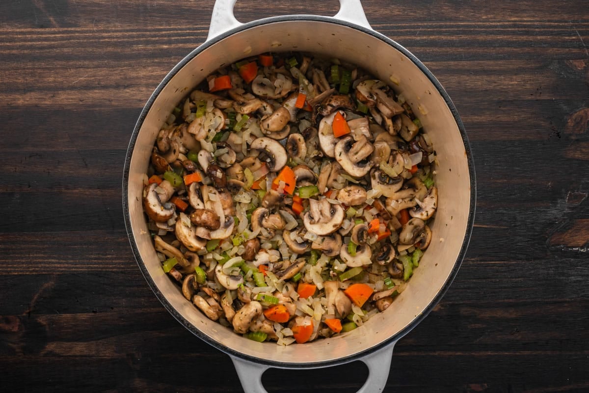 veggies and mushrooms in a dutch oven