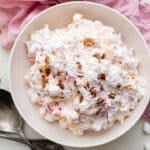 overhead view of a bowl of ambrosia with coconut and pecans