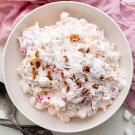 overhead view of a bowl of ambrosia with coconut and pecans