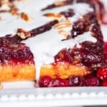 closeup of upside down cranberry cake with glaze