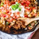 mexican potato skillet on a table with a spoon