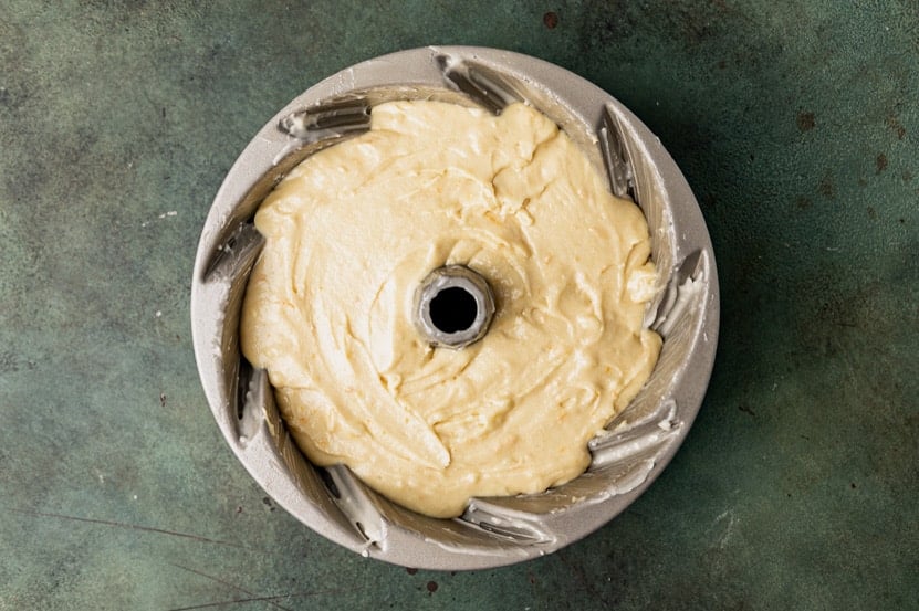 unbaked orange bundt cake in a pan