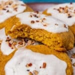 pumpkin cookies with icing on a plate