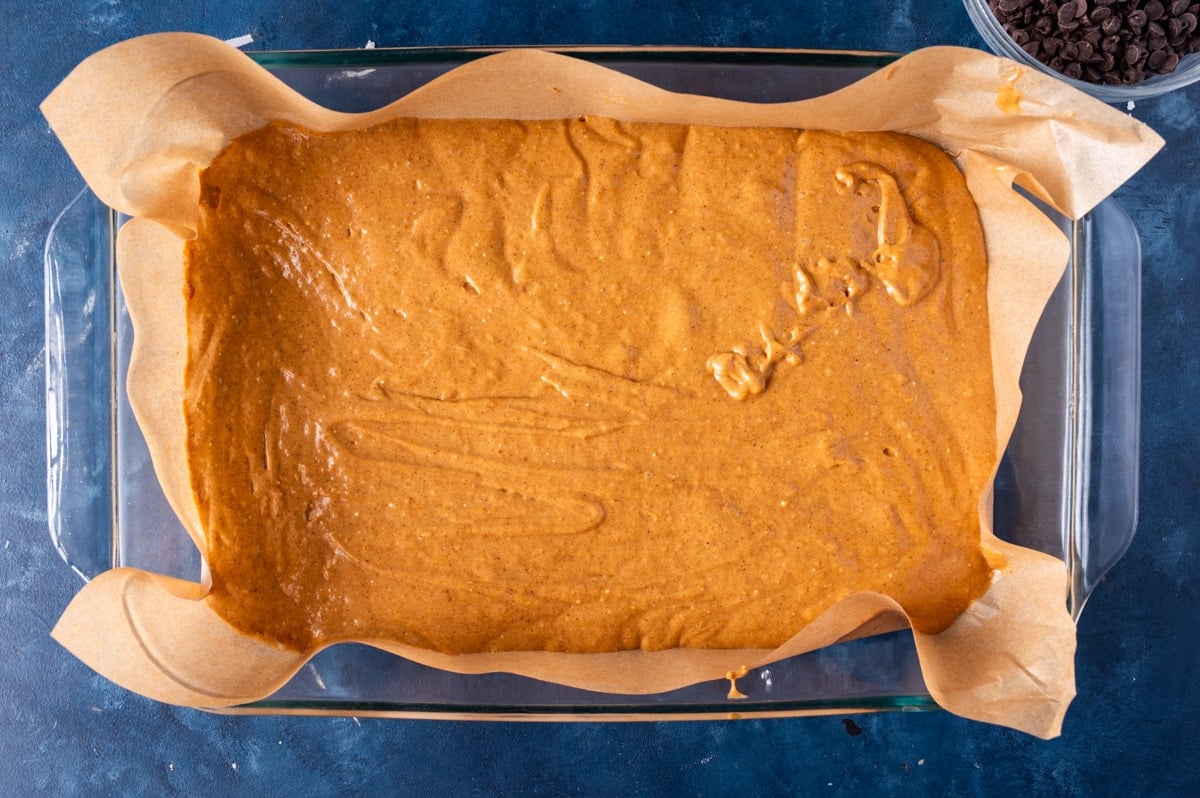 pumpkin cake batter in a 9x13" pan