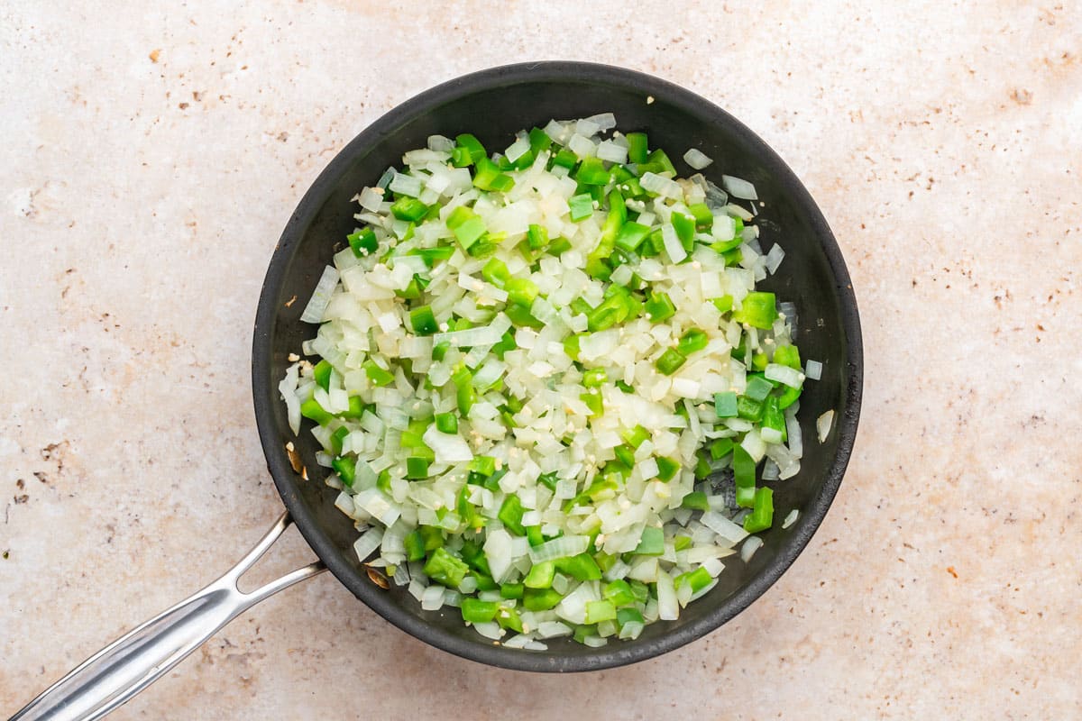 onions, peppers and garlic in a skillet