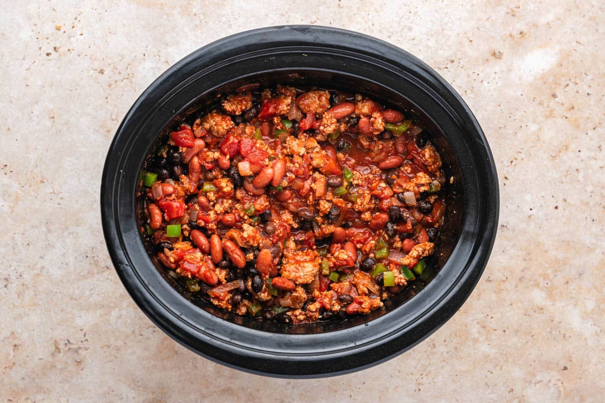 uncooked chili in a slow cooker