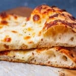 closeup of two sourdough pizza slices