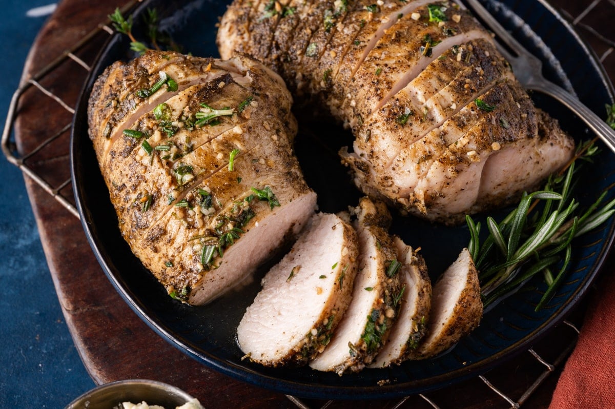 roasted turkey tenderloin sliced on a plate