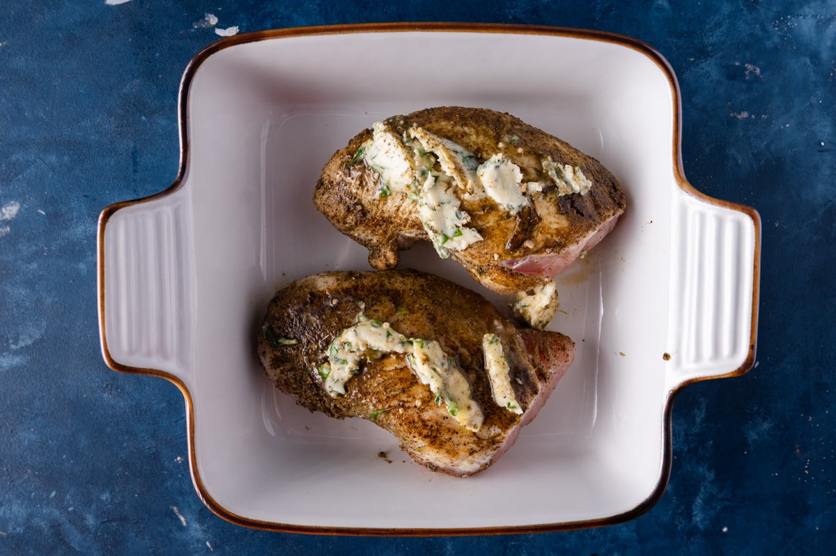 herbed butter spread on top of seared turkey tenderloin