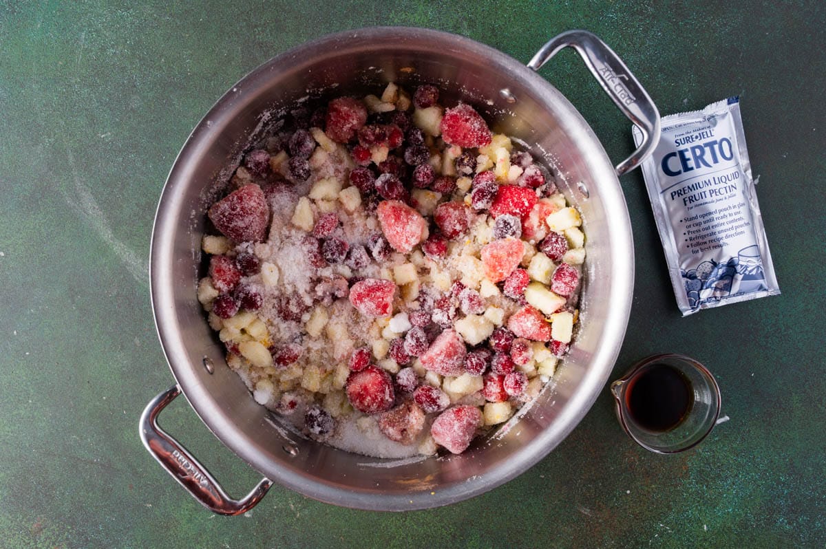 fruit and sugar for jam in a saucepan