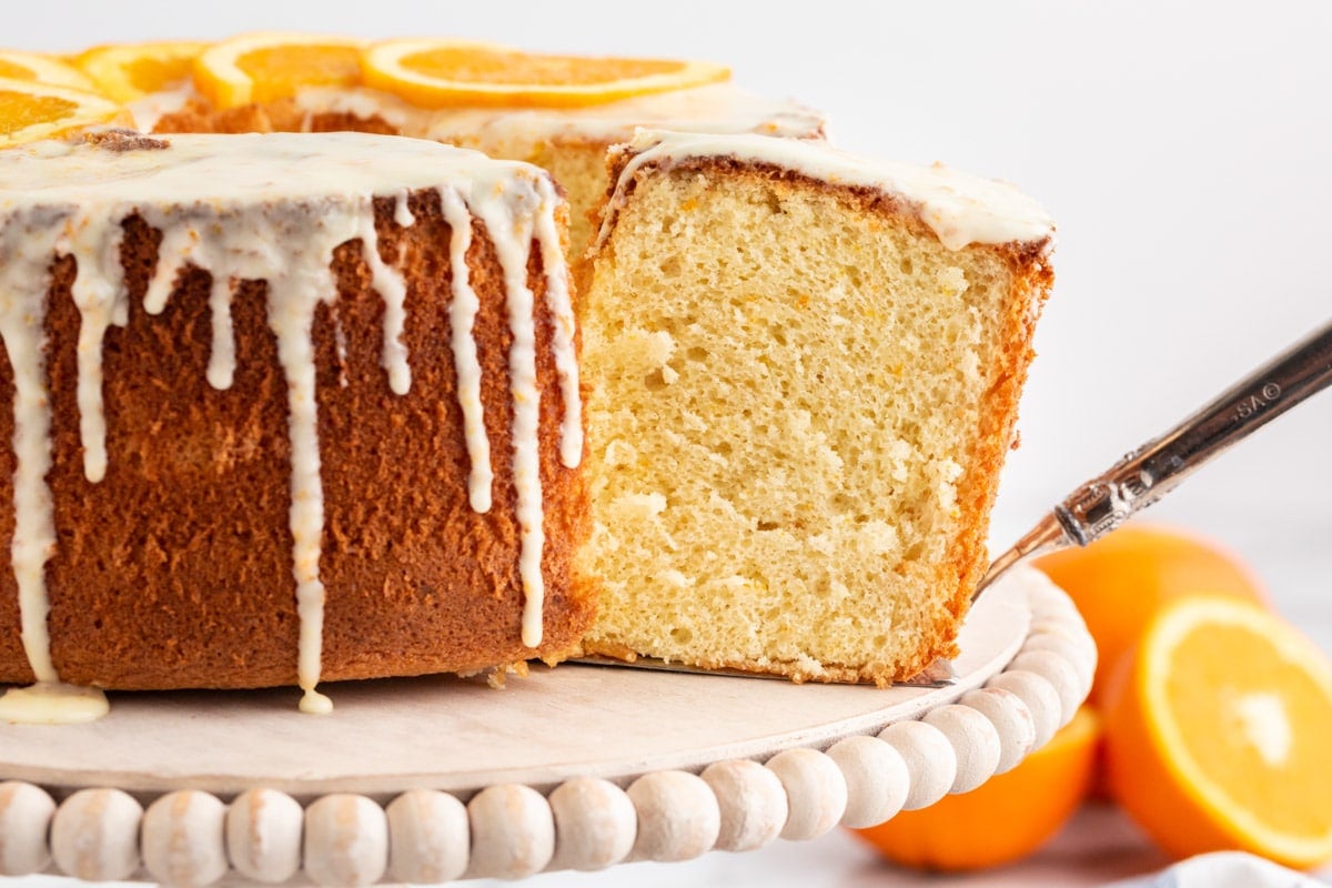 a slice cut out of orange chiffon cake
