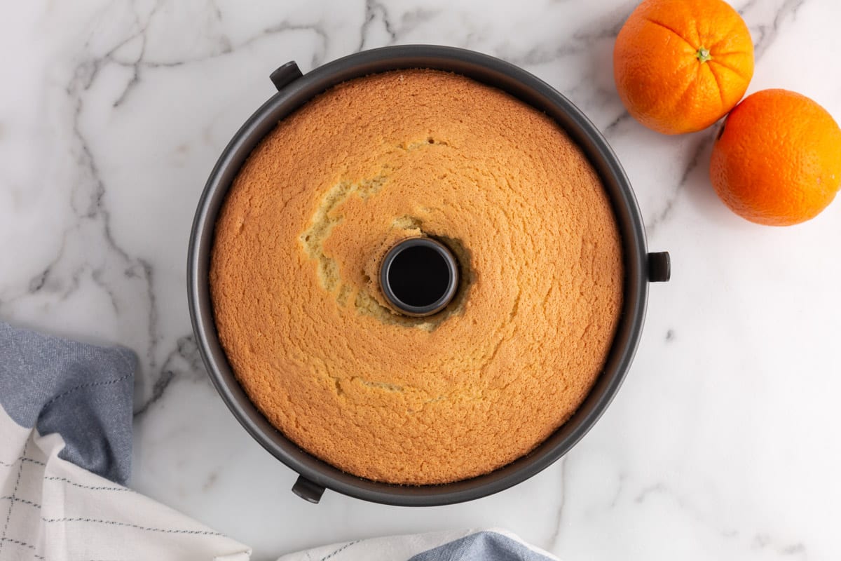 baked chiffon cake in a tube pan on a table