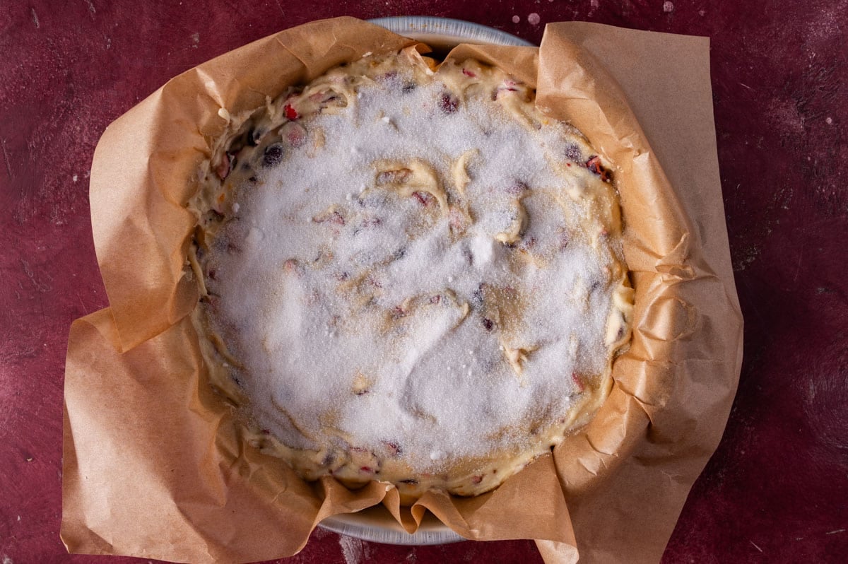 unbaked cranberry cake with sugar on top