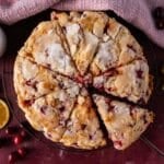 orange cranberry cake cut in 8 slices on a table