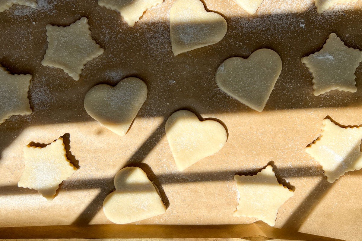 cut out pie crust cookie shapes sprinkled with sugar