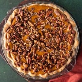 baked pecan pumpkin pie on a table