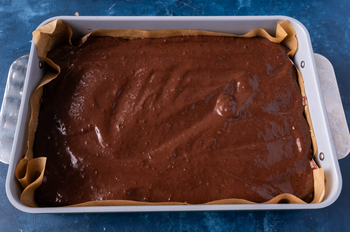 brownies with pudding on top in a pan