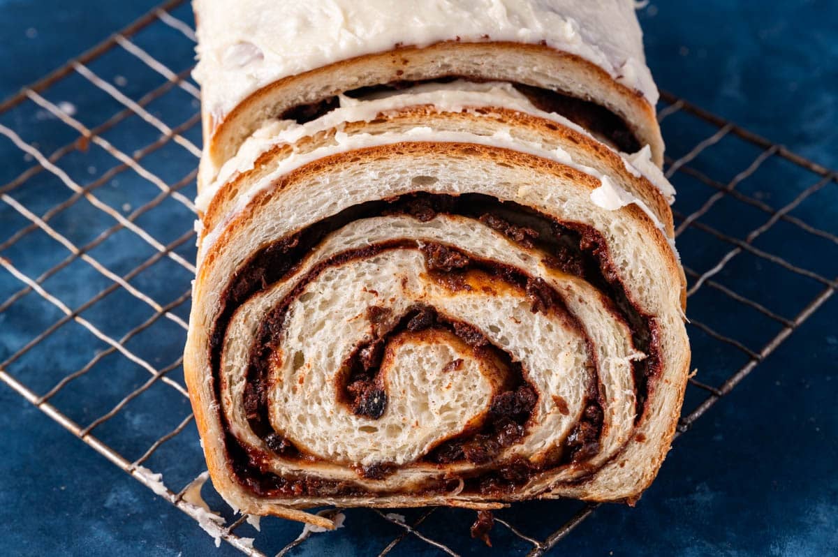 sliced cinnamon raisin bread on a wire rack