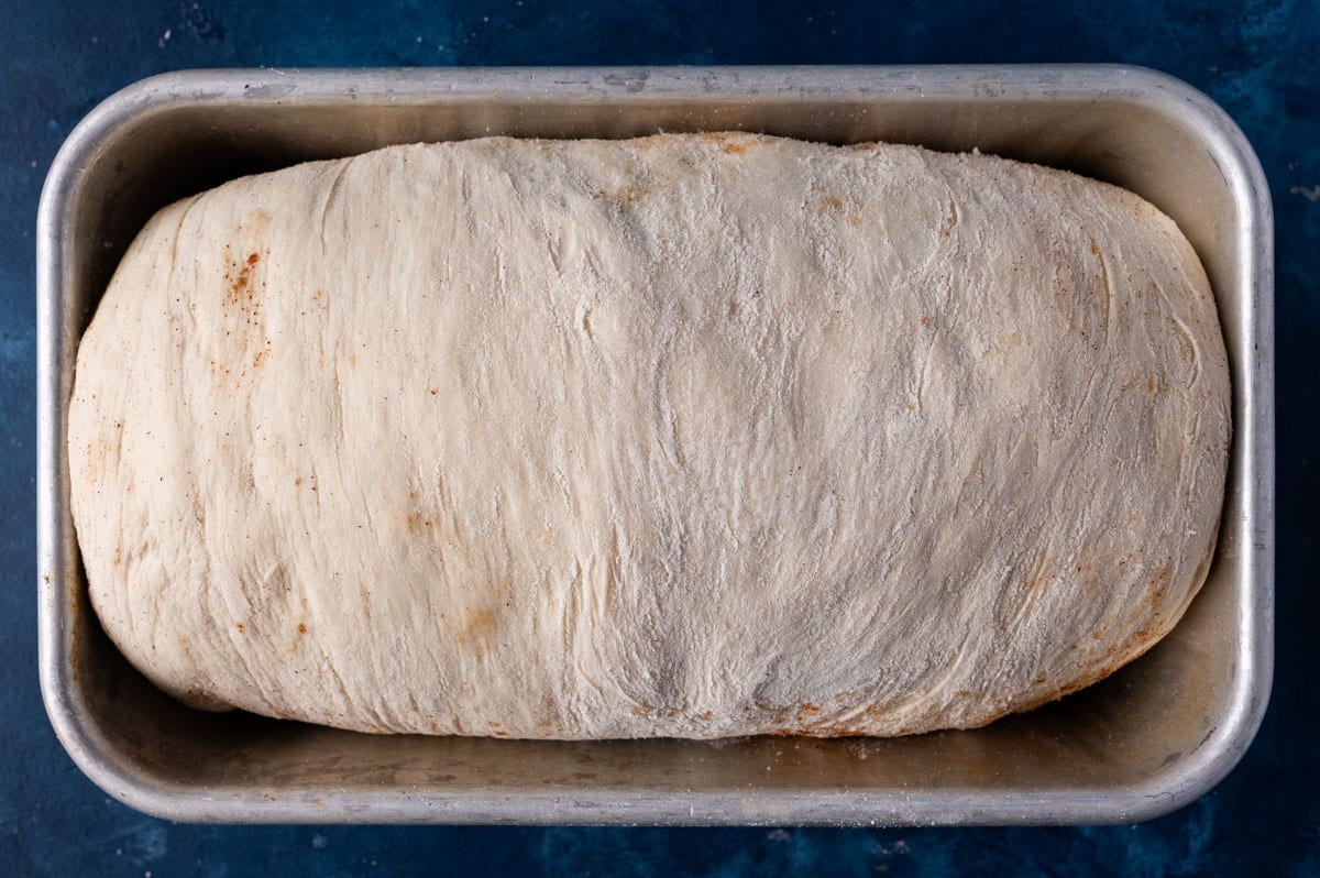 unbaked bread in a loaf pan