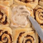 overhead view of cream cheese frosting for cinnamon rolls