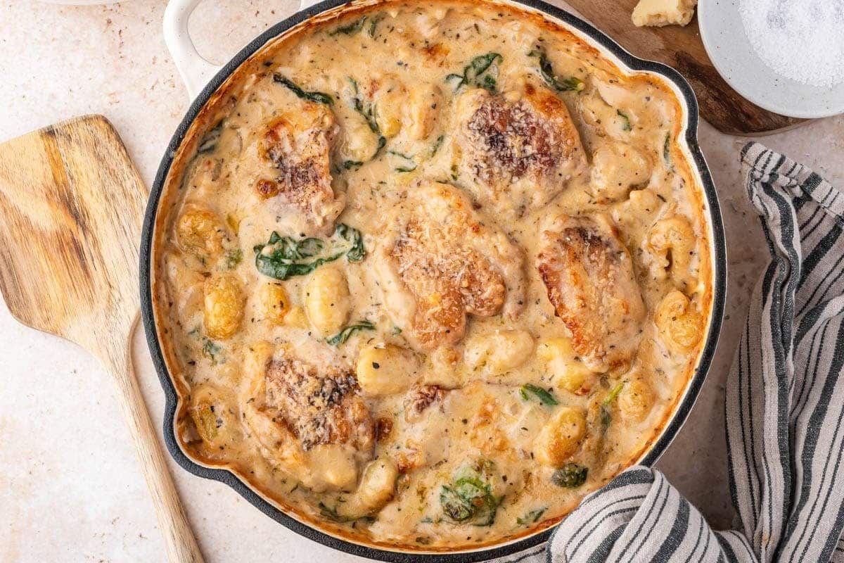horizontal image of creamy chicken gnocchi bake