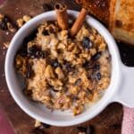 overhead view of hearty oatmeal with raisins and walnuts