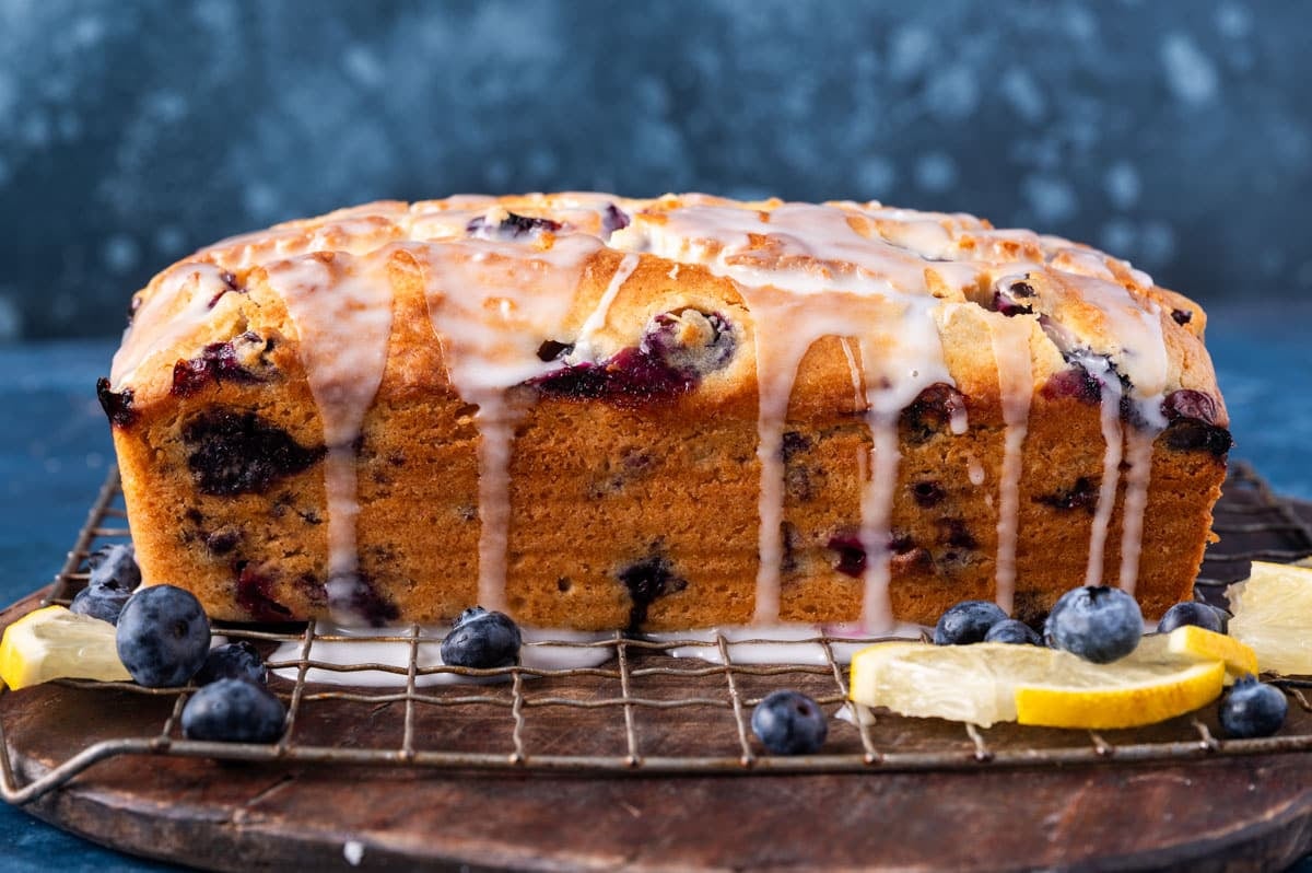 glazed lemon blueberry bread on a wire rack