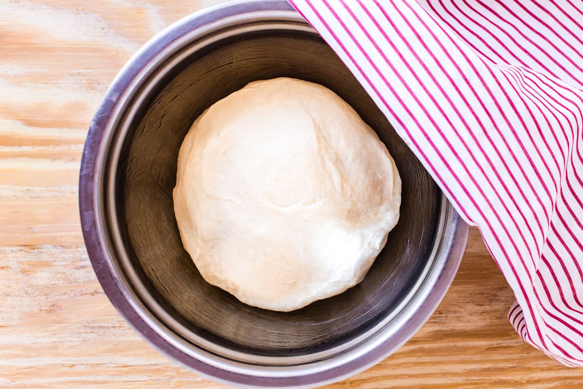 risen dough in a bowl