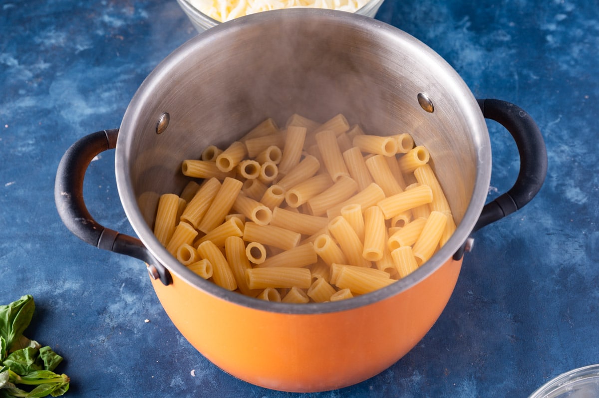 cooked rigatoni pasta in a skillet