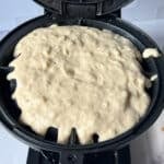 waffle batter in a waffle iron