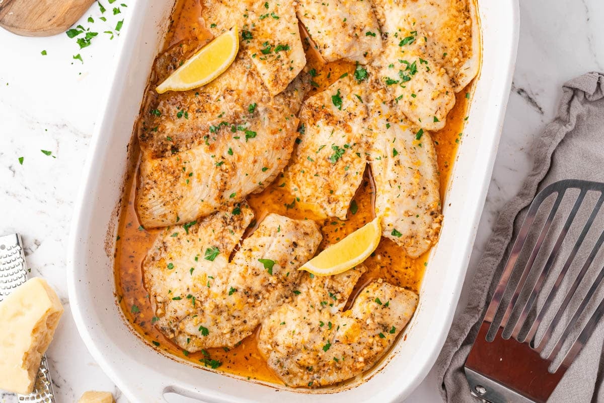 baked tilapia with lemon in a baking pan