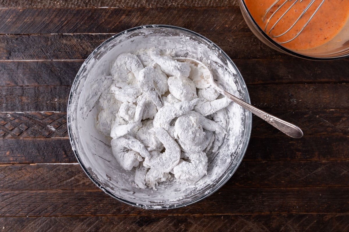 shrimp coated in cornstarch in a bowl