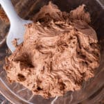 chocolate frosting in a bowl with a spatula
