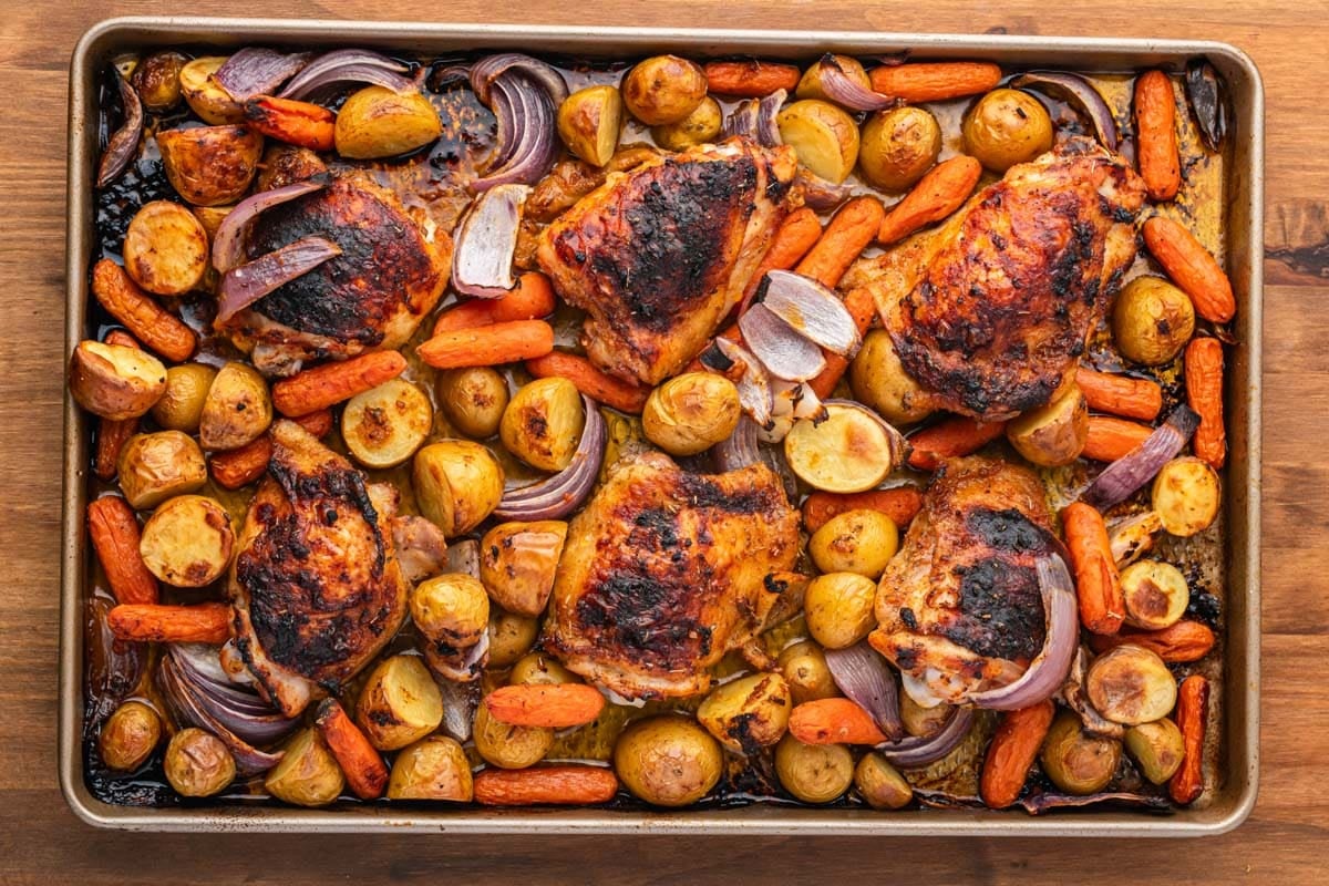 baked chicken and veggies on a sheet pan
