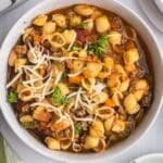 a bowl of pasta fagioli on a table