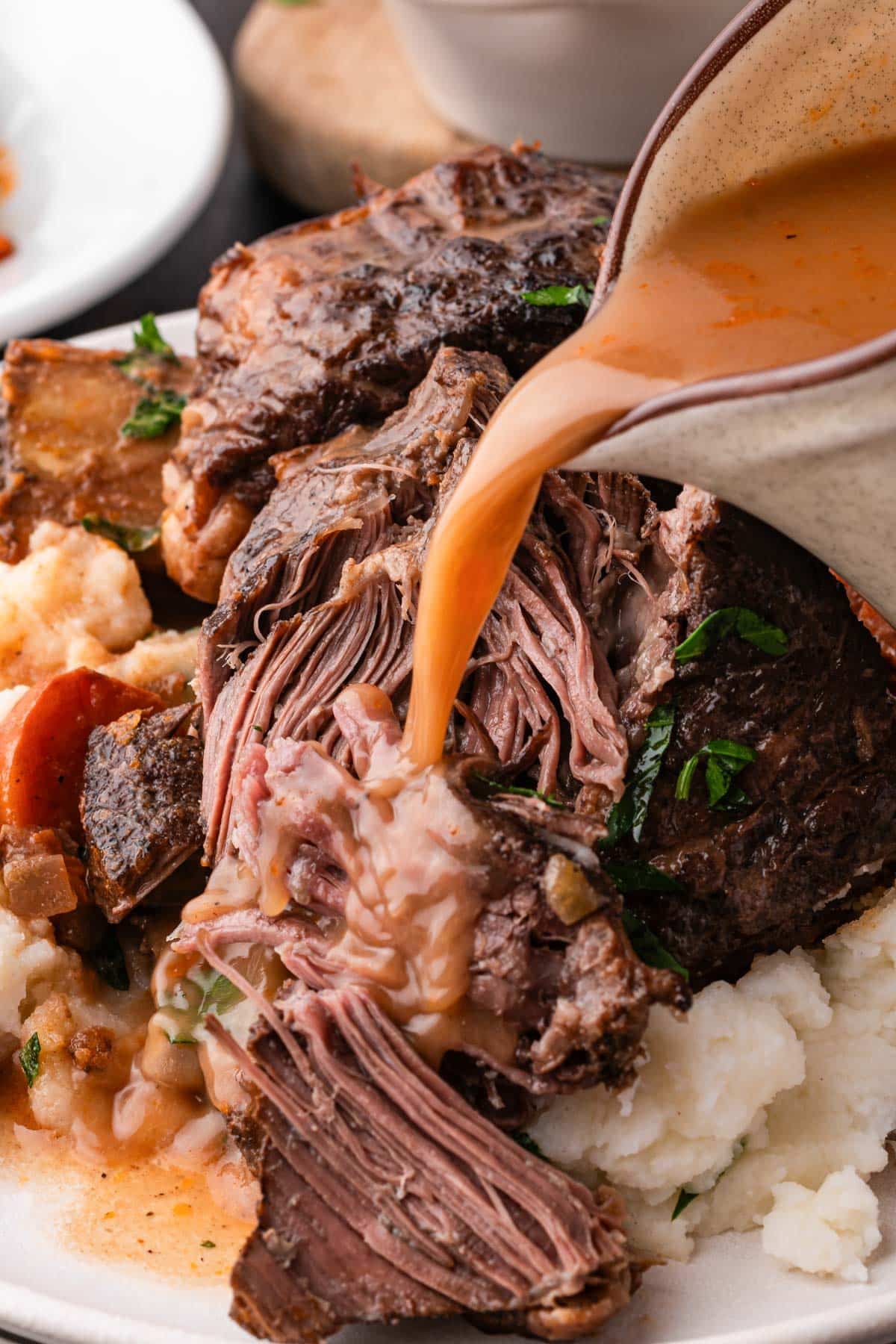 gravy pouring over short ribs