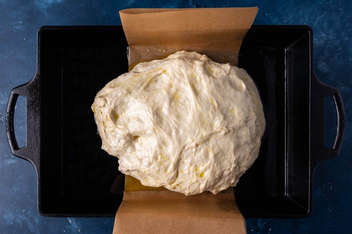 oiled bread dough in a cast iron pan