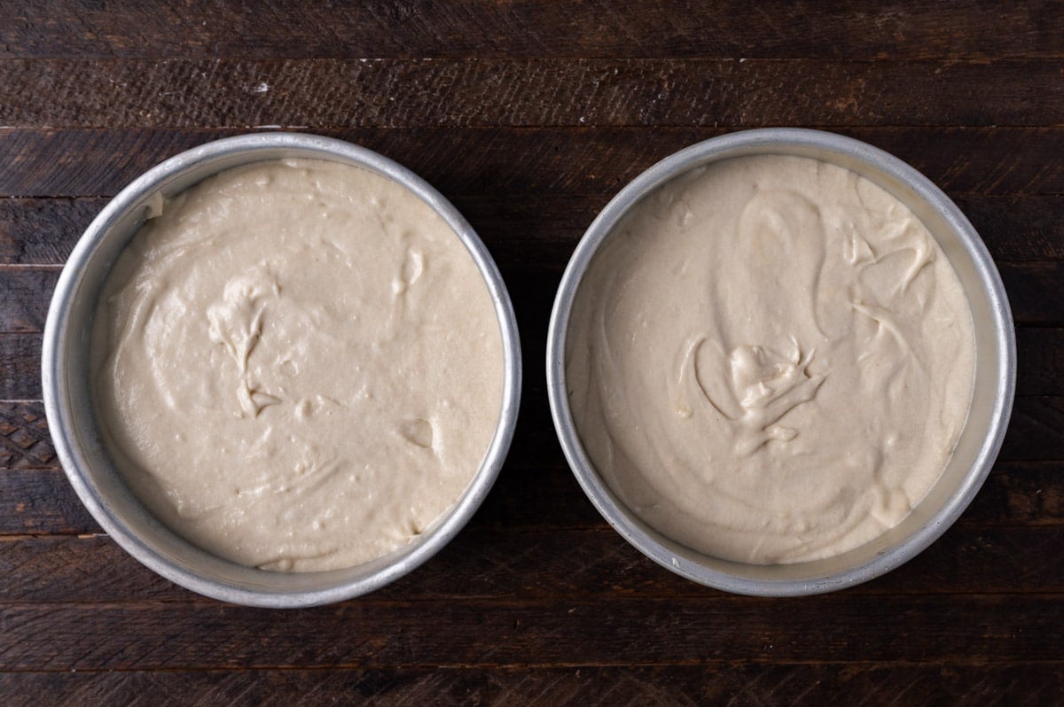 two round unbaked white cakes