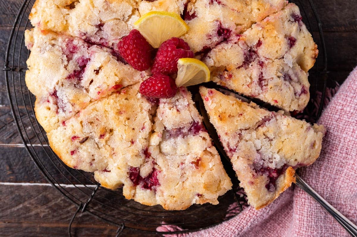 overhead view of lemon raspberry cake sliced 8 slices