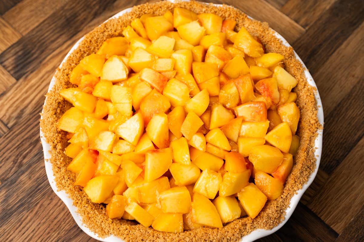 fresh peaches in a graham cracker crust