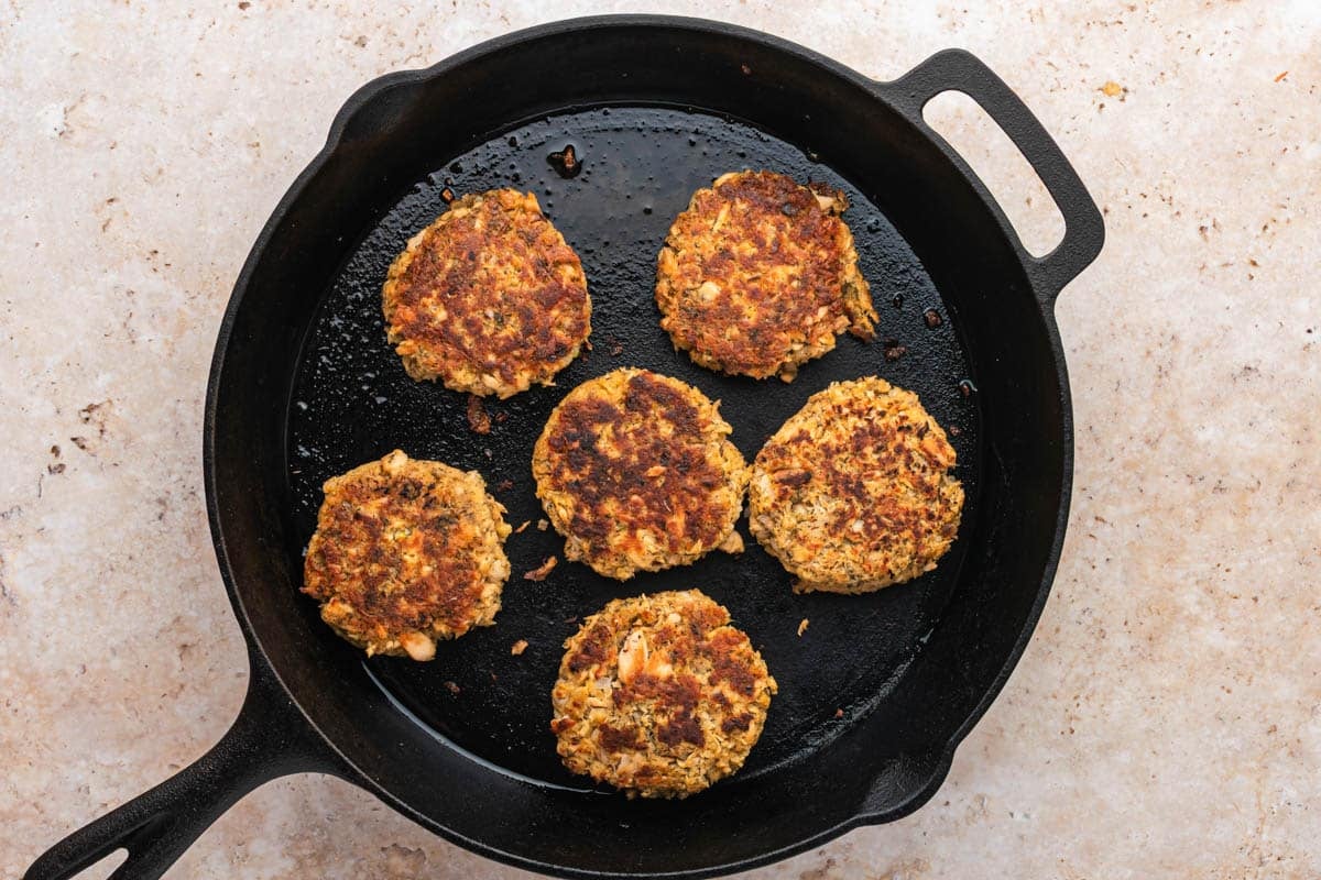salmon cakes in a cast iron skillet